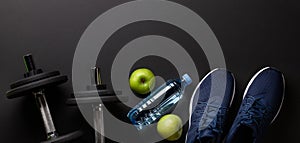 Sneakers, food and dumbbells. Sport, fitness and healthy lifestyle
