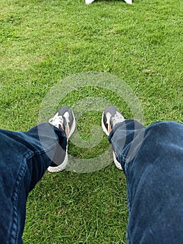 Sneakers and green grass sunset wedding