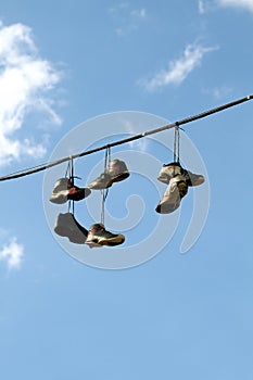 Sneakers Hanging on a Telephone Line