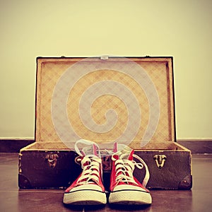 Sneakers and old suitcase