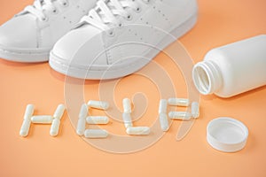 Sneakers and pills. Supportive drugs for the activities. Chondroitin capsules and sneakers. Word help is lined with capsules or