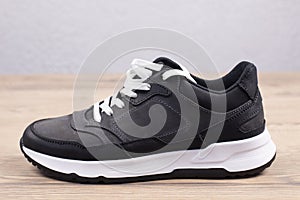 Sneakers Sports shoes with white soles. On a wooden background. Footwear