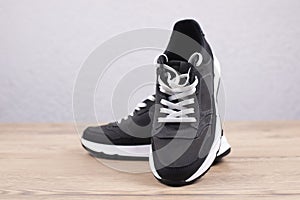 Sneakers Sports shoes with white soles. On a wooden background. Footwear