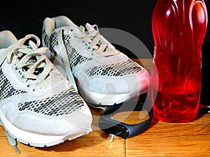 Sneakers, water and smart watch after exercise photo