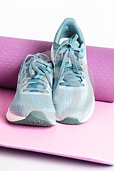 Sneakers and yoga mat.