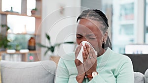 Sneeze, blowing nose and sick black woman with tissue on a sofa for allergies, hay fever or viral infection at home