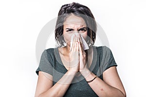 Sneeze girl having flu on white studo background photo