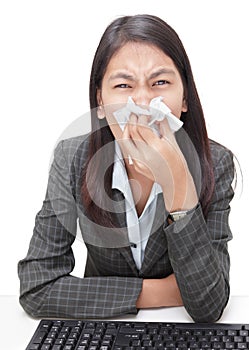 Sneezing businesswoman w flu photo