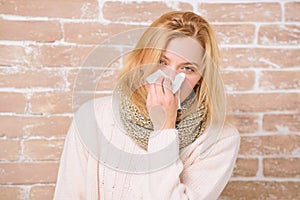 Sneezing just keep coming. Sick woman blowing her nose in napkin. Pretty girl sneezing of seasonal influenza virus. Cute