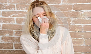 Sneezing non stop. Pretty girl sneezing of seasonal influenza virus. Cute woman caught nasal cold or allergic rhinitis