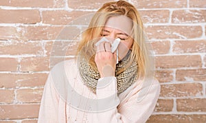 Sneezing non stop. Pretty girl sneezing of seasonal influenza virus. Cute woman caught nasal cold or allergic rhinitis