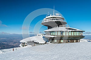 Snezka summit hut in sunny winter day, Krkonose mountains, Czech republic photo