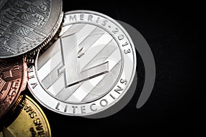 Sniny silver litecoin on a black background