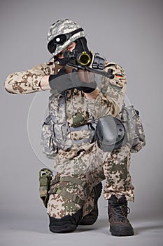 Sniper with rifle aiming