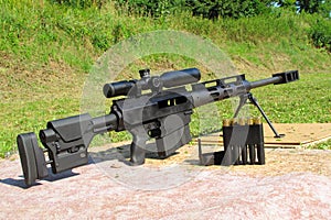 Sniper rifle caliber .50 BMG with ammo photo