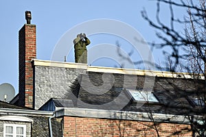 Sniper securing a perimeter from a rooftop