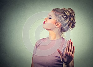Snobby annoyed angry woman giving talk to hand gesture