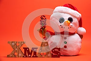 Snoman toy with wooden Xmas text sign