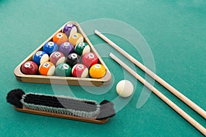 Snooker billards pool balls, cue, brush, chalk on green table