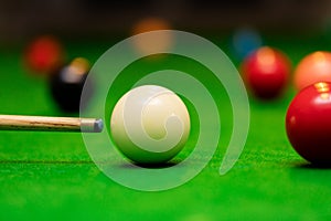 Snooker game - player aiming the cue ball