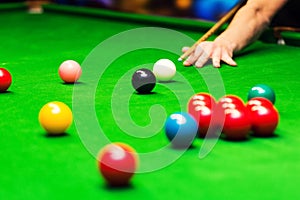 Snooker - man aiming the cue ball