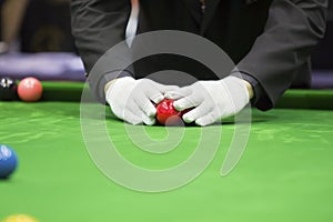Snooker referee set up ball for new game