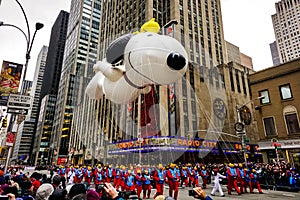 Snoopy balloon floats in the air during the annual Macy`s Thanksgiving Day parade along Avenue of Americas