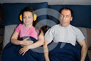 Snoring Husband Man And Partner Woman With Headphones
