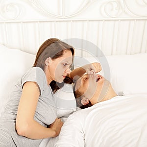 Snoring man in bed