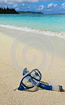 Snorkel on sandy tropical beach