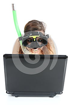 Snorkel woman websurfing in a netbook computer