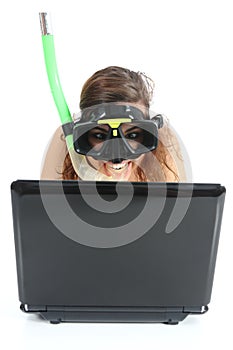 Snorkel woman websurfing in a netbook computer photo