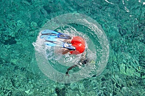 Snorkeler diving in the sea