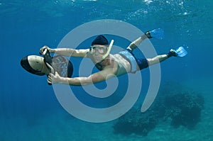 Snorkeler on underwater scooter photo