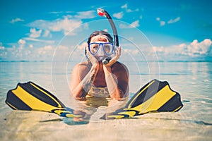 Snorkeler woman having fun on the tropical beach