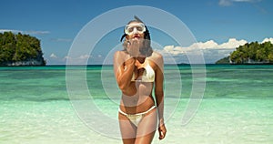 Snorkeling, summer beach and woman blow kiss for outdoor freedom, wellness and affection. Ocean, sea and scuba diver