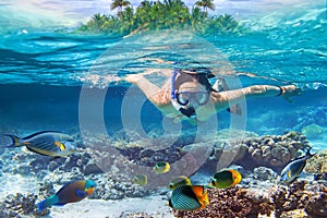 Snorkeling in the tropical water of Maldives photo