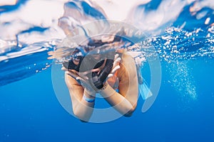 woman is amazed by snorkeling with the whale shark