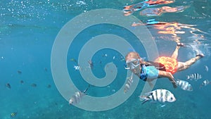 Snorkeling woman split view