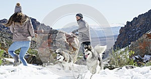 Snow, animals or couple playing a game with freedom, adventure or fun on holiday vacation. Happy man, woman or people on