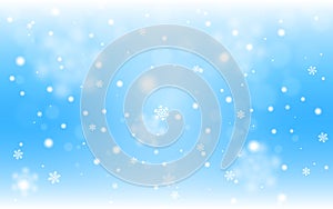 Snow background blue. Christmas snowfall with defocused flakes. Winter concept with falling snow. Holiday texture and