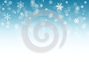 Snow background. Blue Christmas snowfall with defocused flakes. Winter concept with falling snow. Holiday texture and white