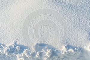 Snow background with sunlight and space for text at the top of the frame