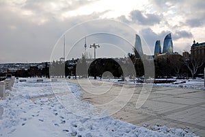 Snow on Baku Bulvar, with the Flame Towers in the background