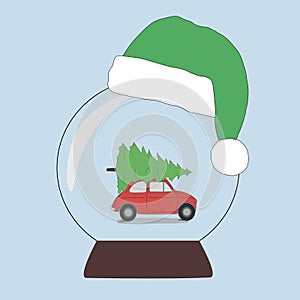 A snow ball in a New Year`s cap. the car is carrying a Christmas tree for the holiday. The concept of New Year and Christmas holid