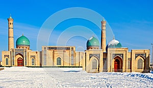 Snow and blue domes and minarets of Hazrati Imam complex, religious center of Tashkent