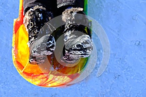 Snow Boots in Sled on Snow Winter Time Playing