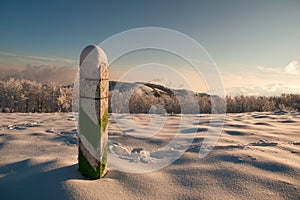 Snow border post in the mountains