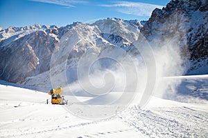 Snow cannon in action at mountain ski resort