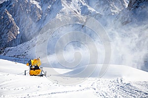 Snow cannon in action at mountain ski resort
